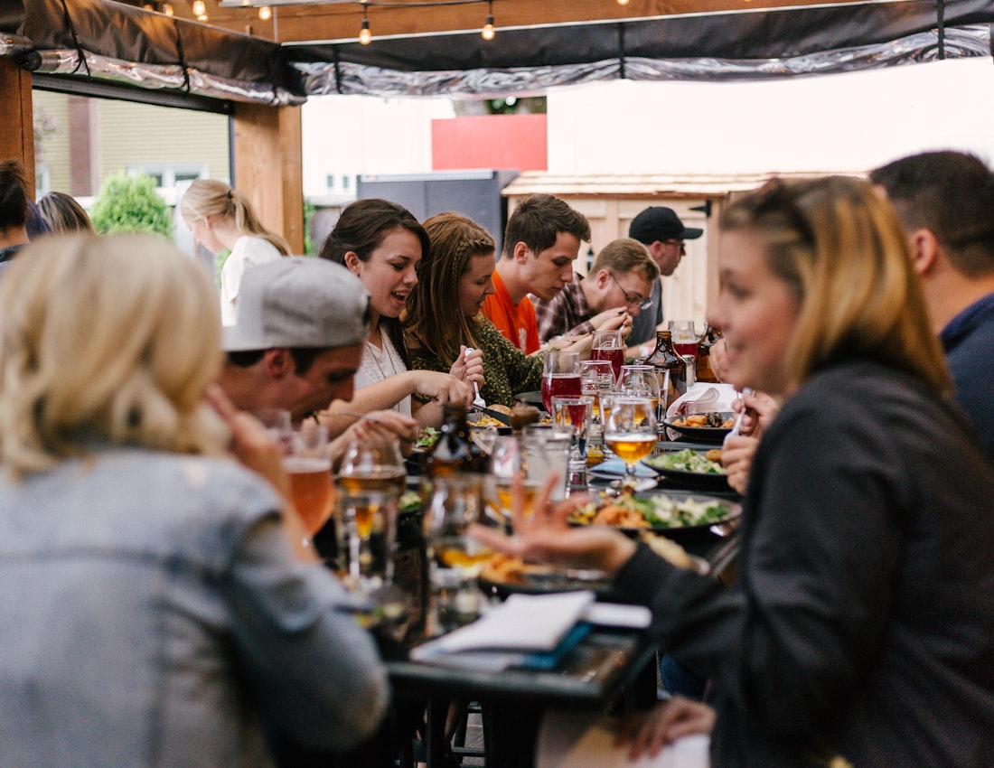 Guests talking and laughing across a dinner table