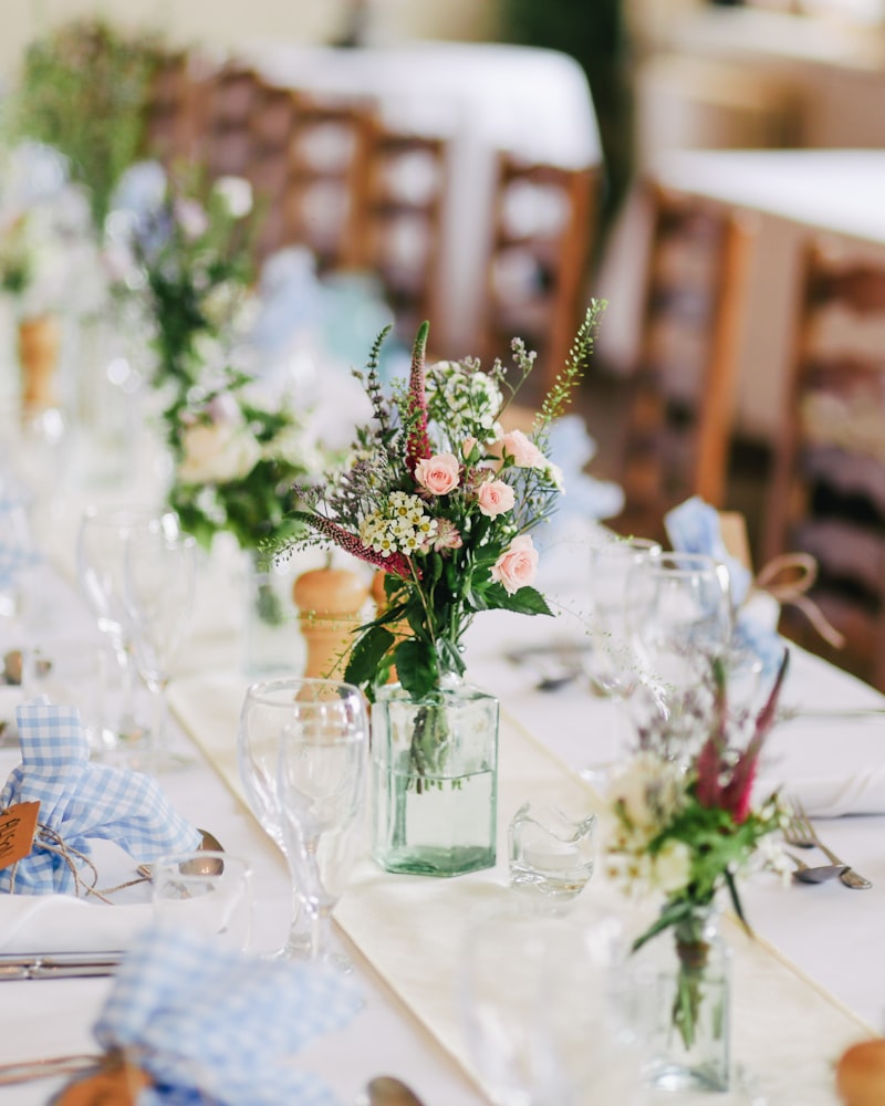 Wedding guests raising glasses at a candlelit reception table