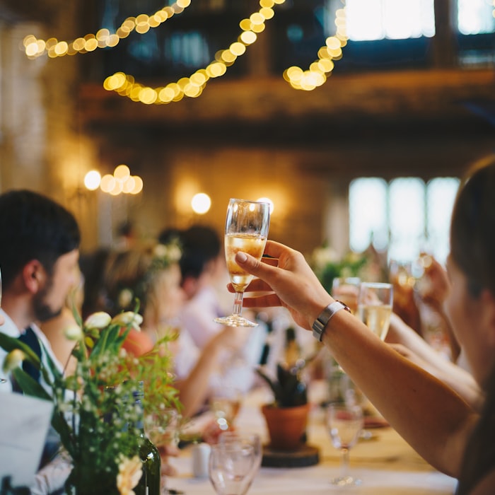 A long reception table set for dinner in the evening